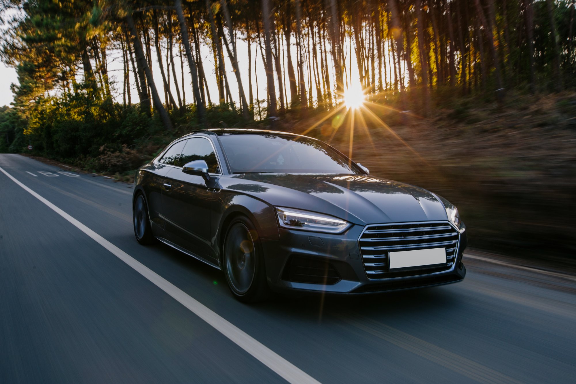 black-sport-car-highway-drive-sunset