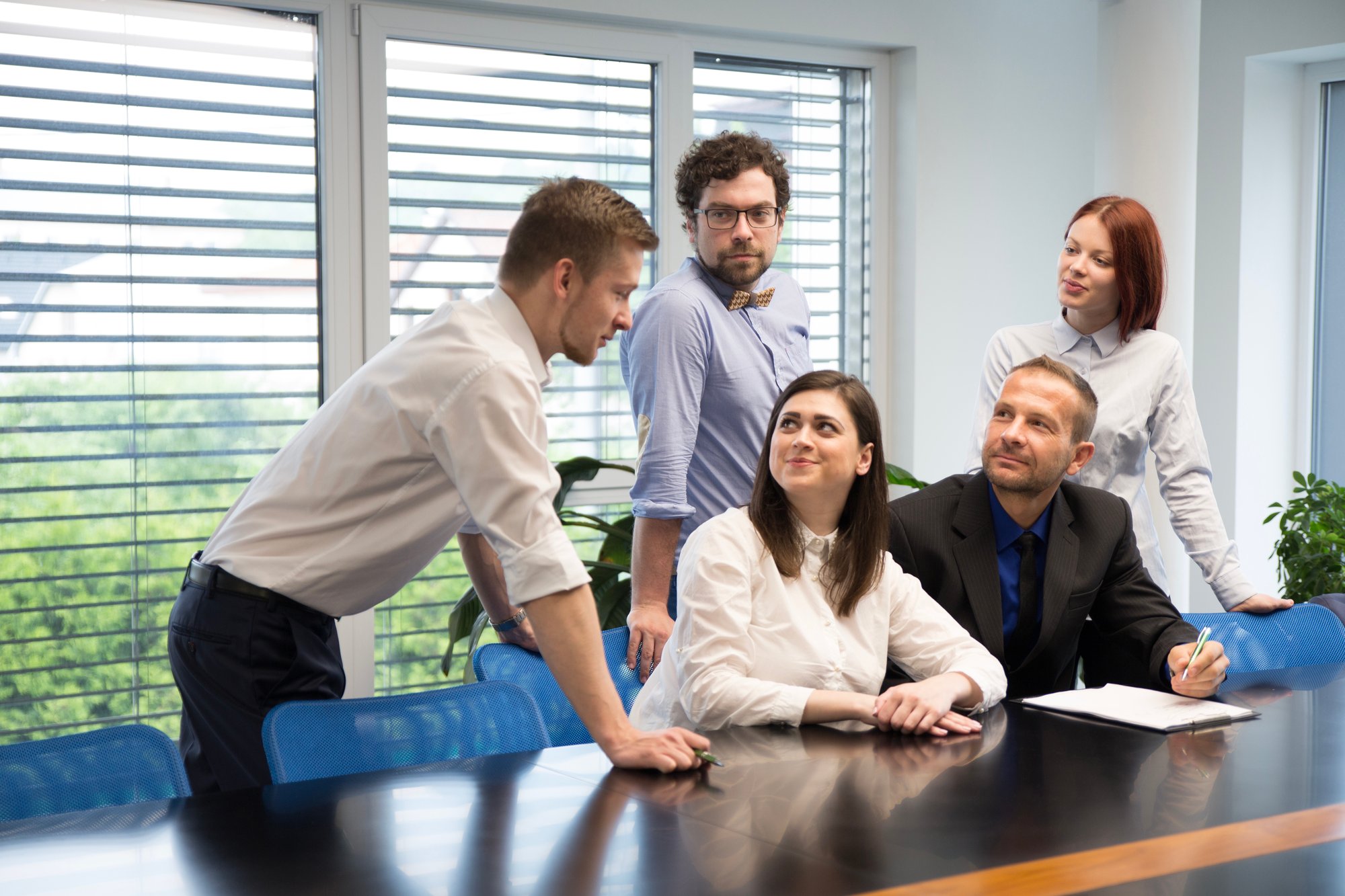 excited-coworkers-discussing-new-plant