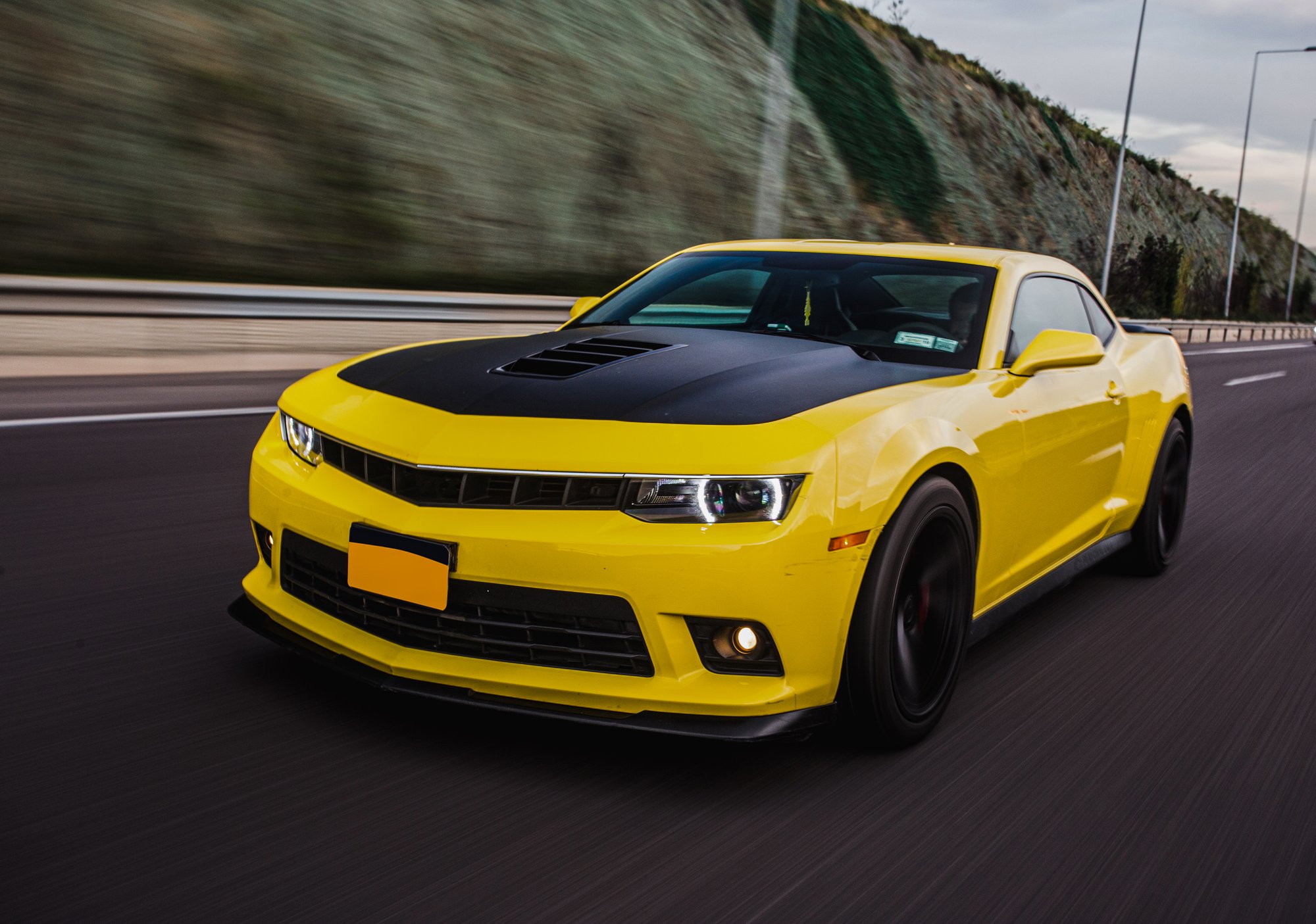 yellow-sport-car-with-black-autotuning-road